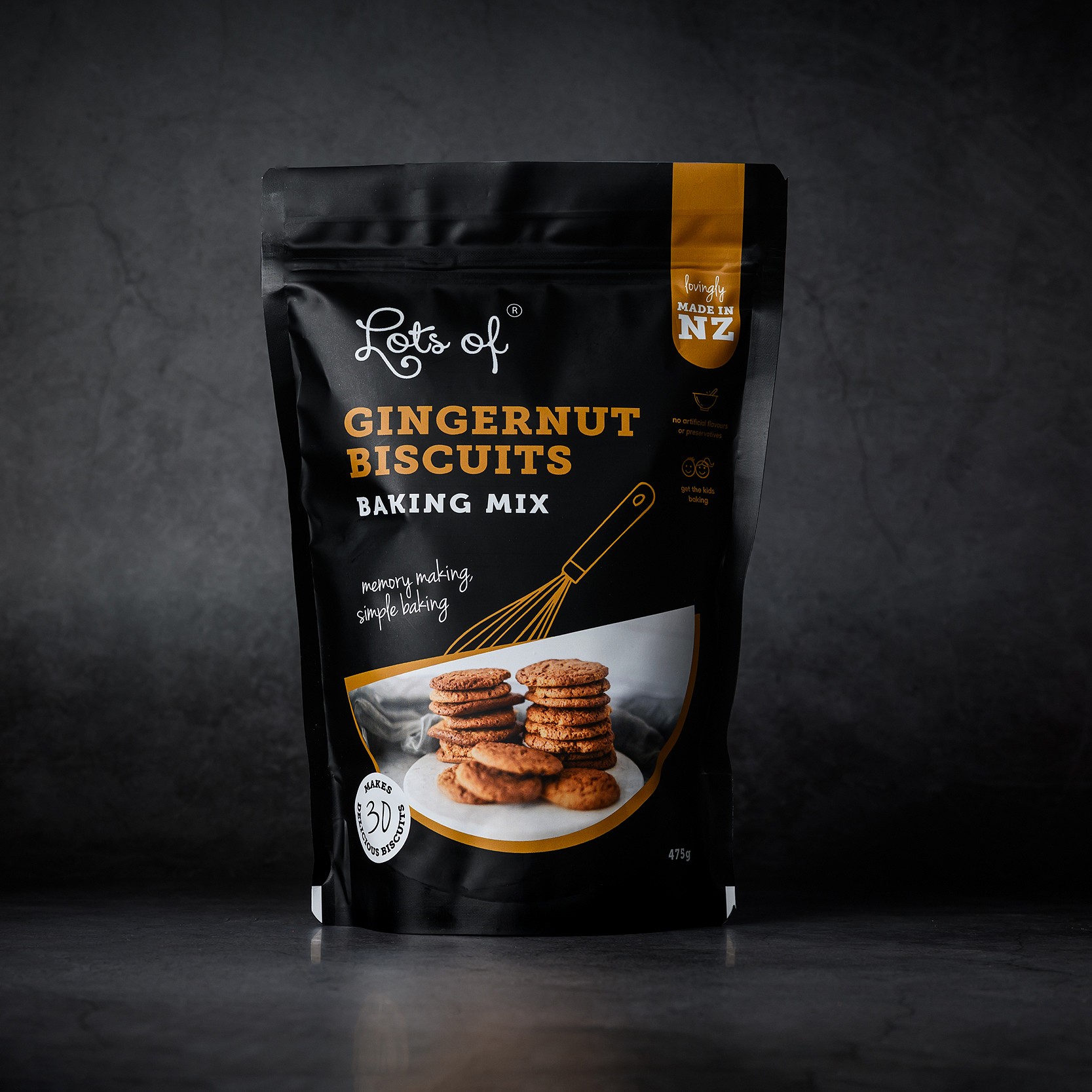 Gingernuts Baking Mix 2 ots of Baking Mixes Gingernut Biscuits Baking Mix pouch on a dark background, New Zealand made gingernut biscuit baking mix for easy homemade baking.