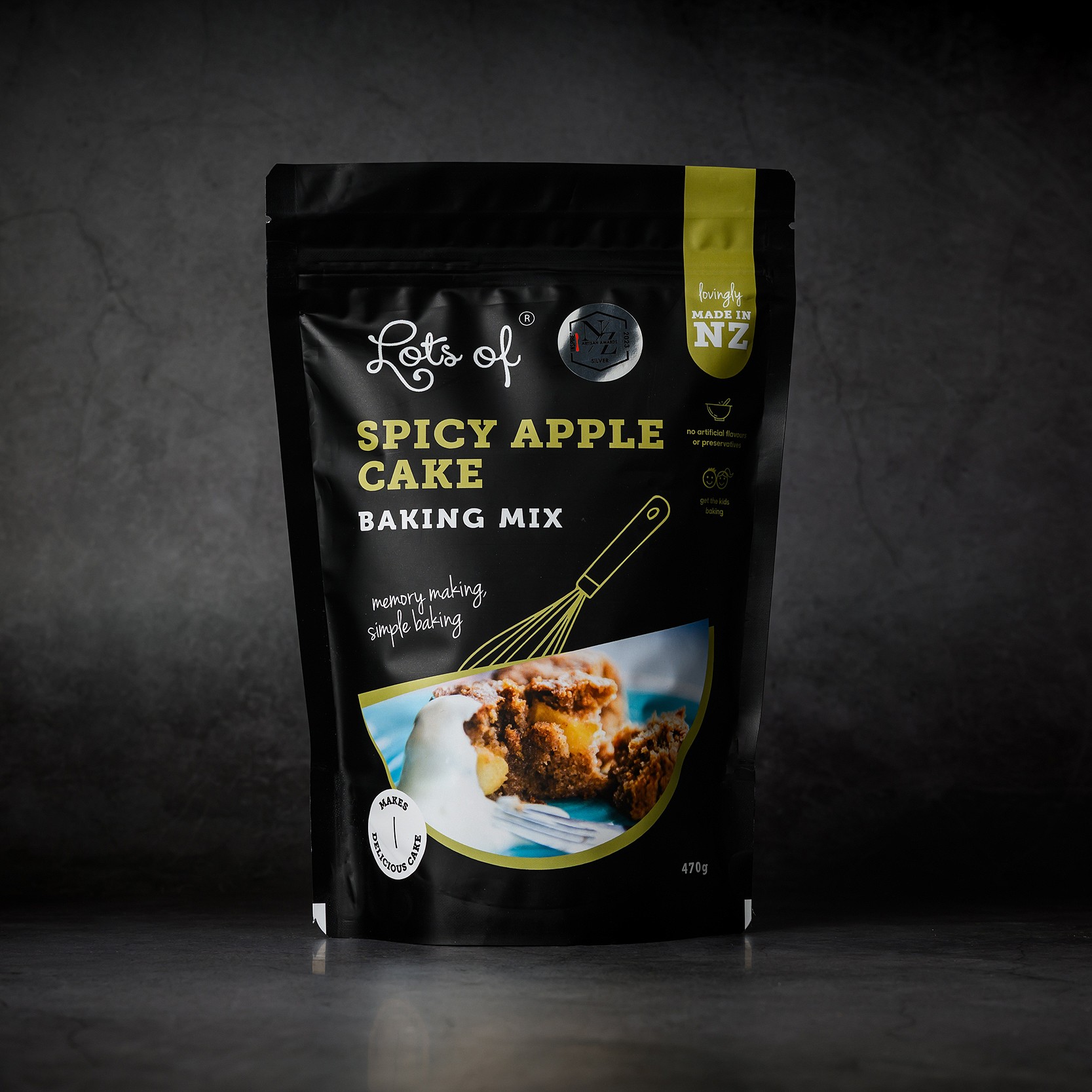 Spicy Apple Cake Baking Mix 5 Lots of Baking Mixes Spicy Apple Cake Baking Mix pouch on a dark background, New Zealand made apple spice cake baking mix for easy homemade baking.